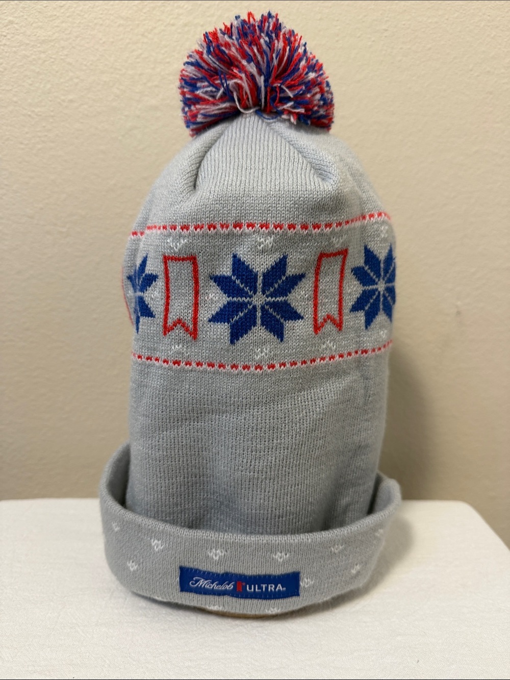 Michelob ULTRA Grey Winter Pom Beanie with Blue & Red Snowflake Pattern